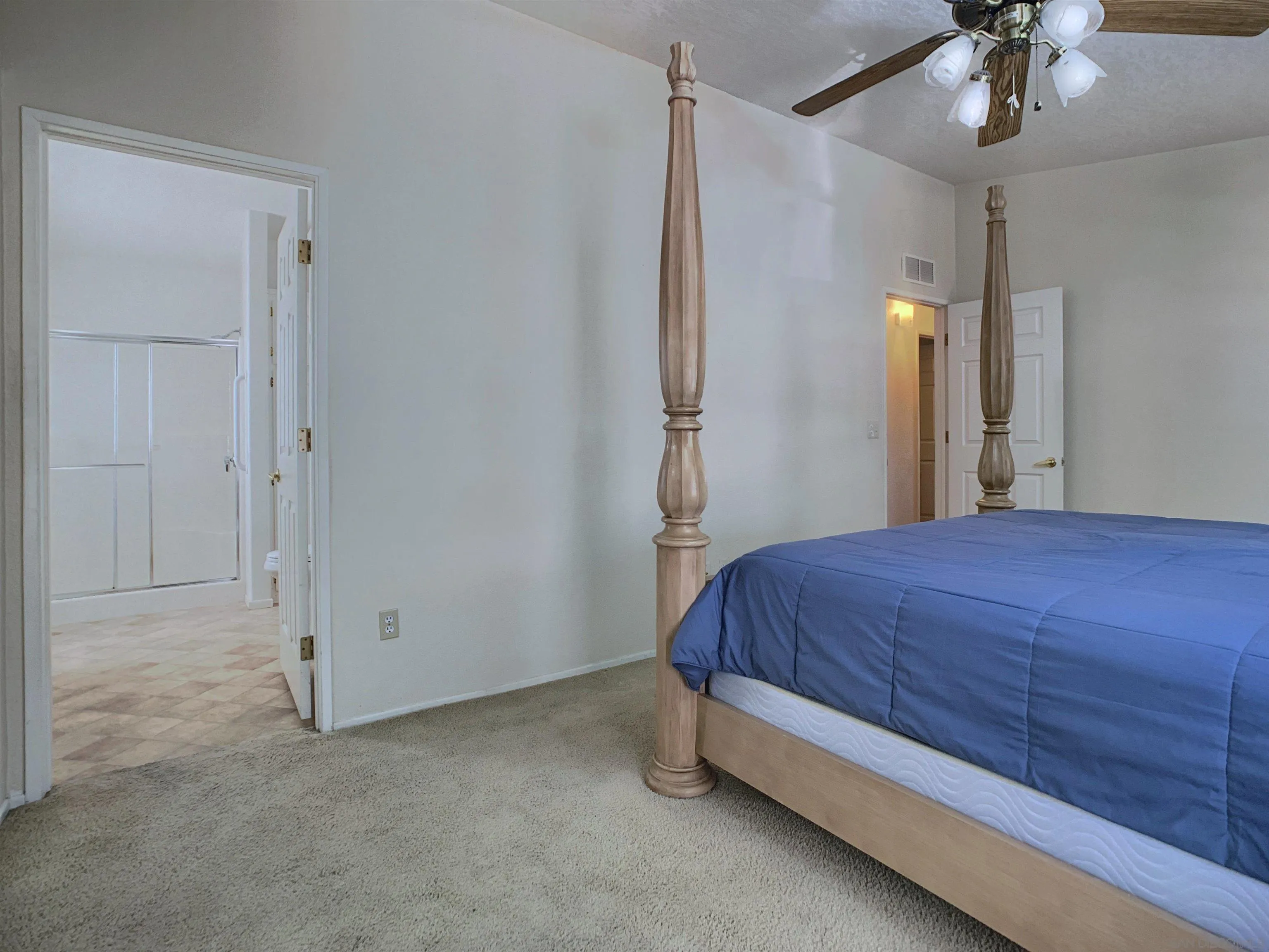 9500 Harritt Road, Unit SPC 25 Lakeside, CA 92040 - Photo 21 of 43 a spacious bedroom with a bed and a chandelier
