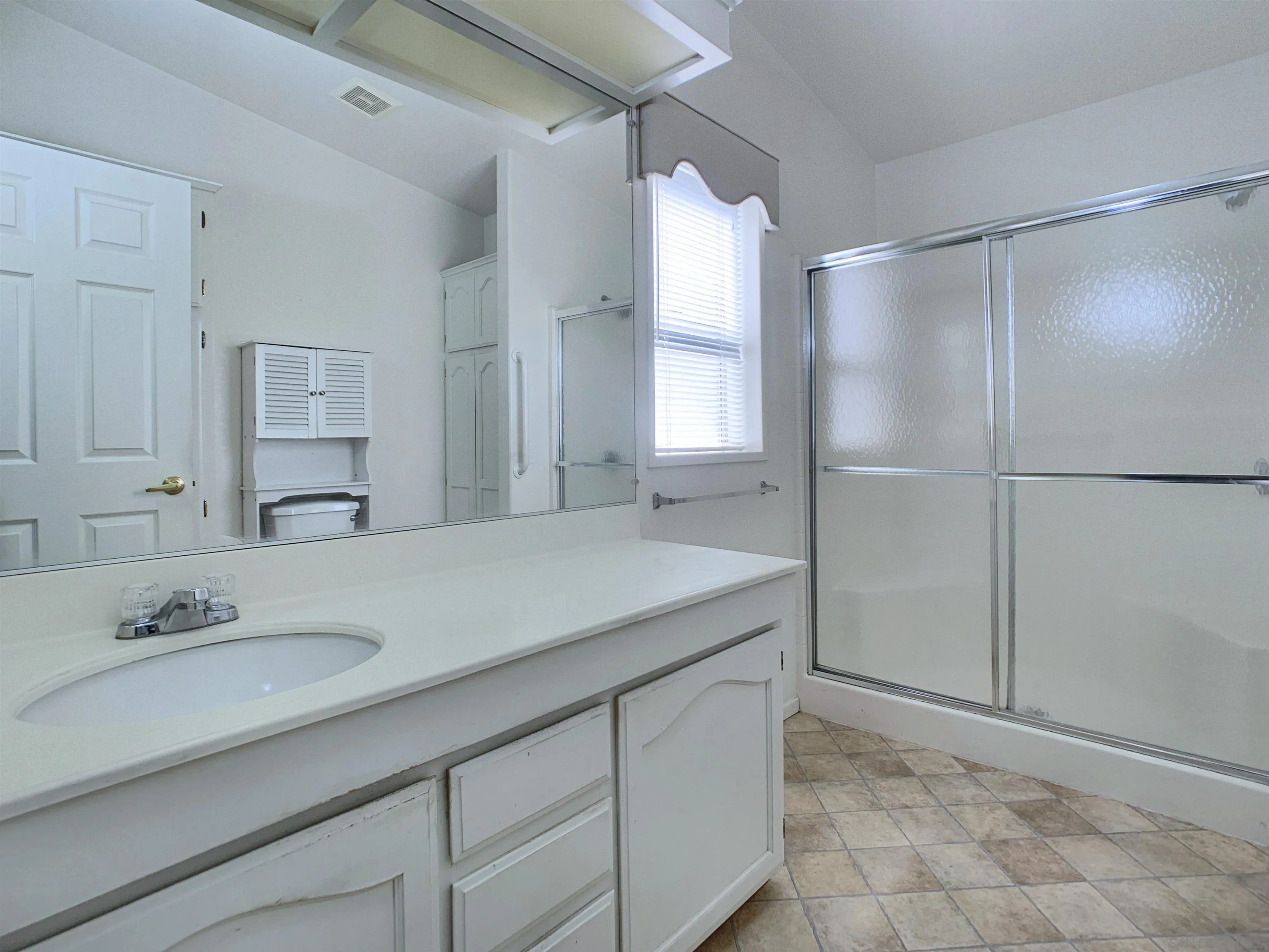 9500 Harritt Road, Unit SPC 25 Lakeside, CA 92040 - Photo 22 of 43 a bathroom with a granite countertop sink and a mirror
