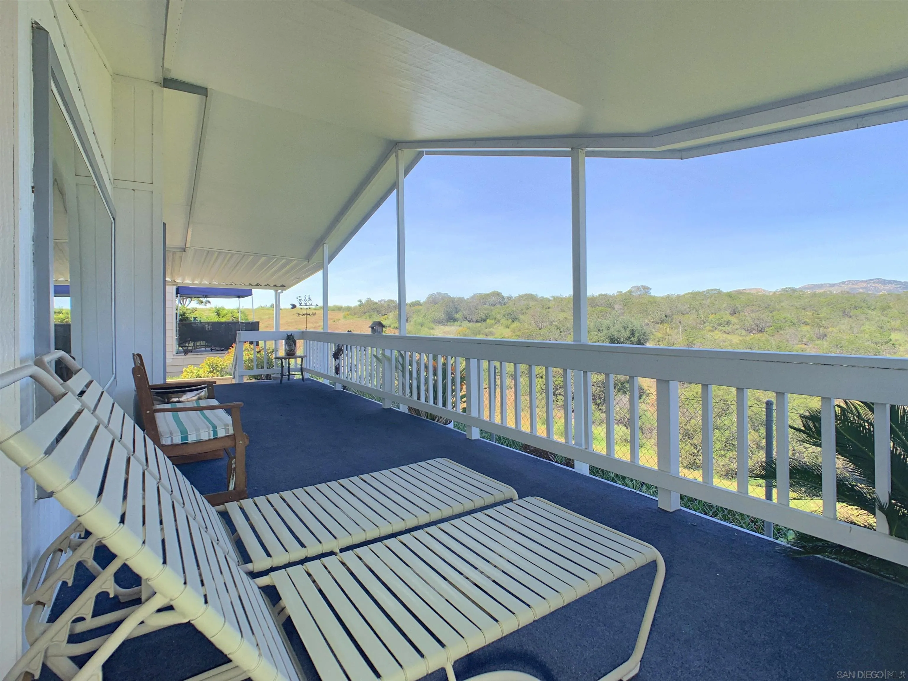 9500 Harritt Road, Unit SPC 25 Lakeside, CA 92040 - Photo 3 of 43 a balcony with wooden floor and outdoor seating