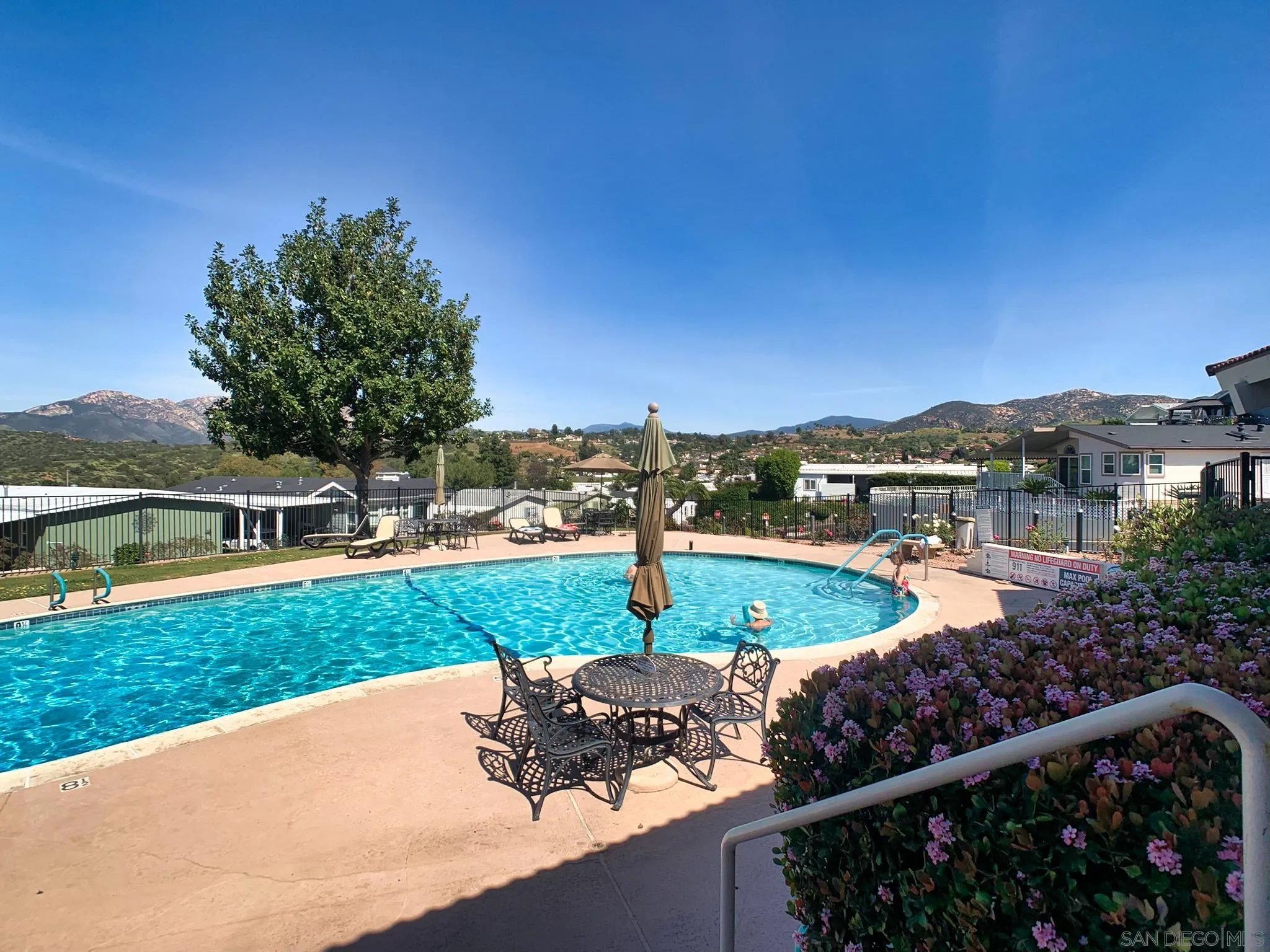 9500 Harritt Road, Unit SPC 25 Lakeside, CA 92040 - Photo 35 of 43 a view of a swimming pool and a yard