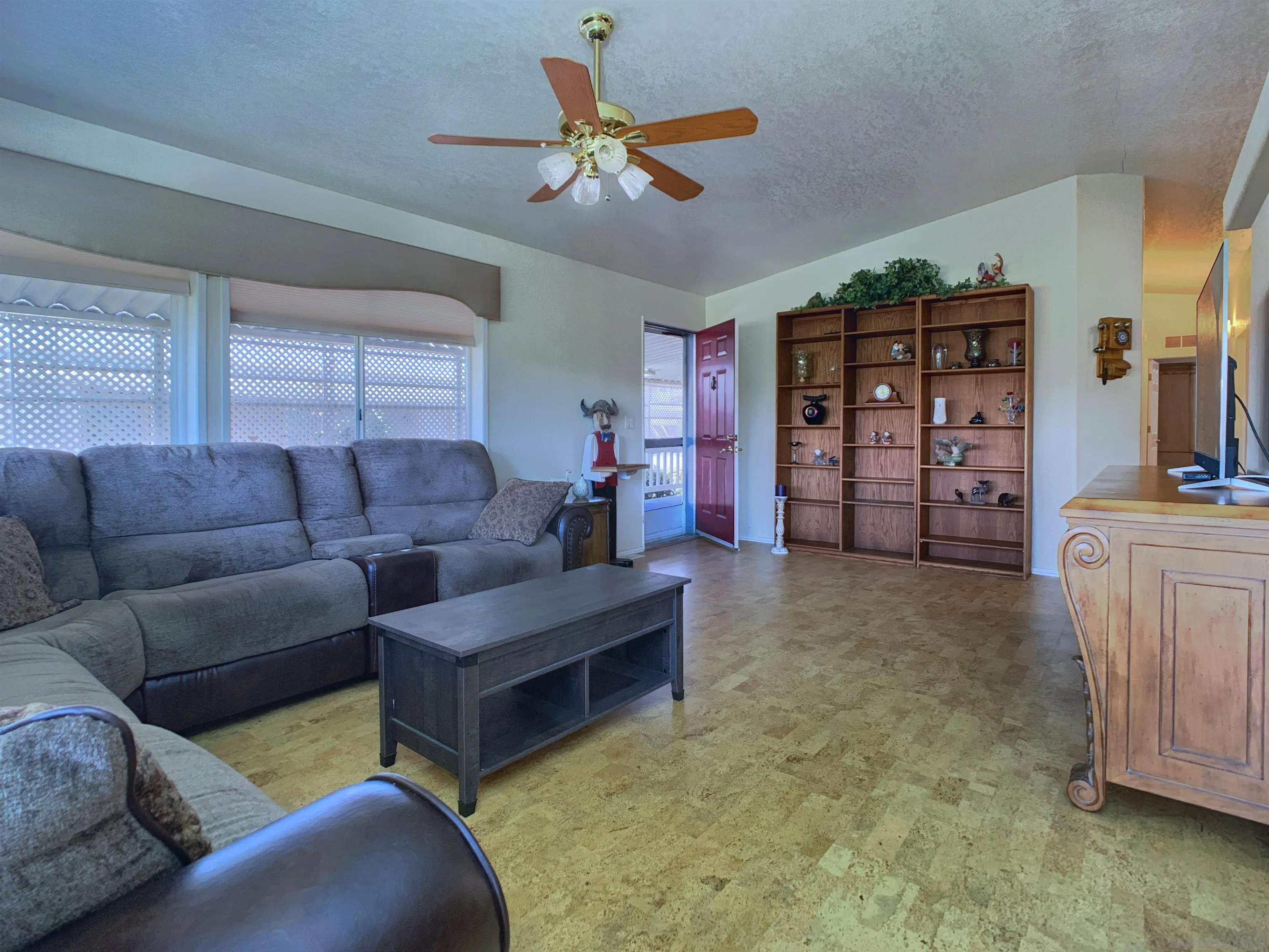9500 Harritt Road, Unit SPC 25 Lakeside, CA 92040 - Photo 6 of 43 a living room with furniture and a flat screen tv