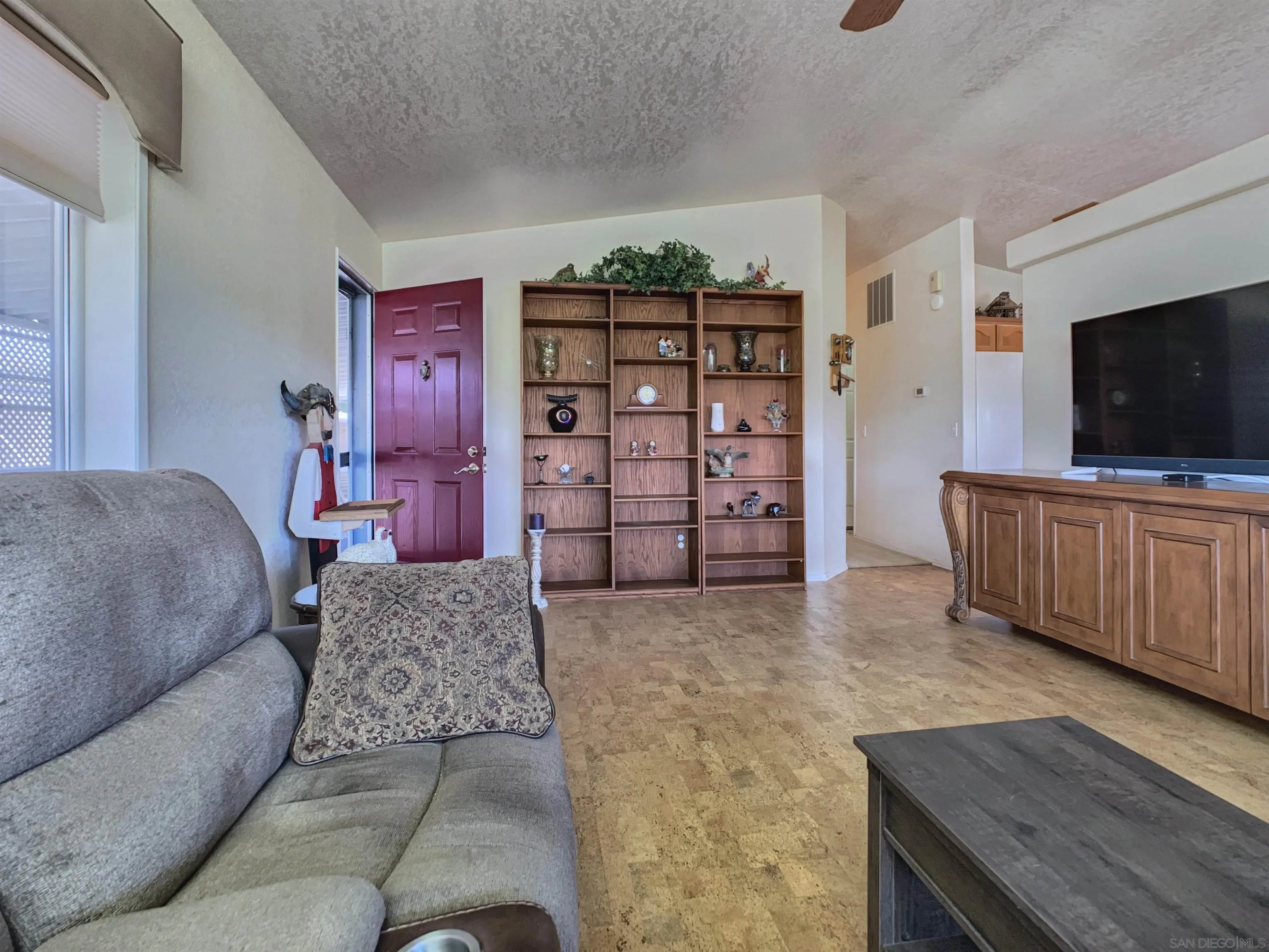 9500 Harritt Road, Unit SPC 25 Lakeside, CA 92040 - Photo 7 of 43 a living room with furniture and a flat screen tv