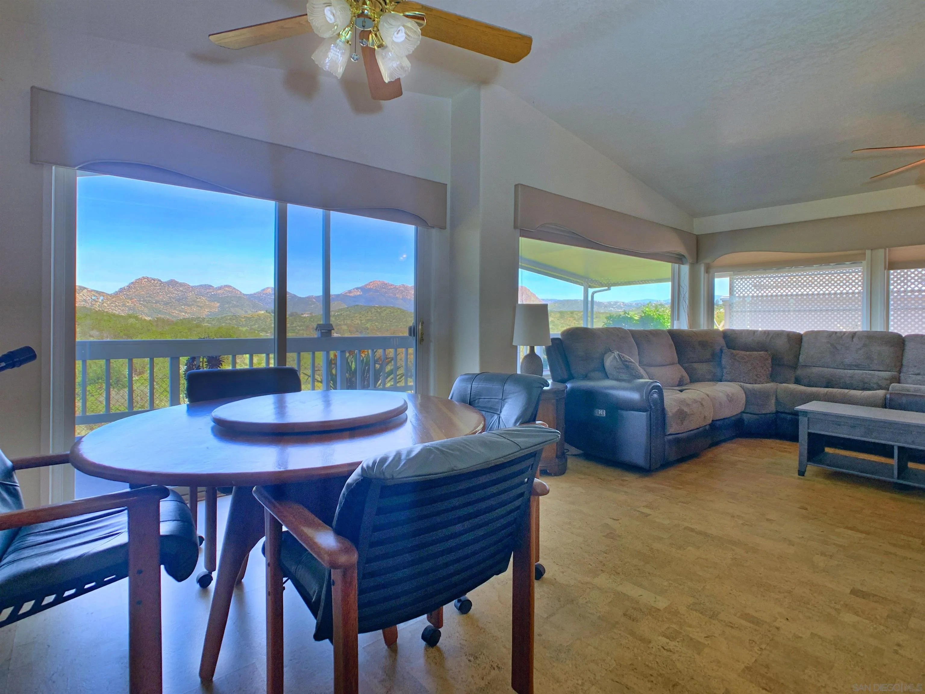 9500 Harritt Road, Unit SPC 25 Lakeside, CA 92040 - Photo 9 of 43 a view of a dining room with furniture large windows and wooden floor