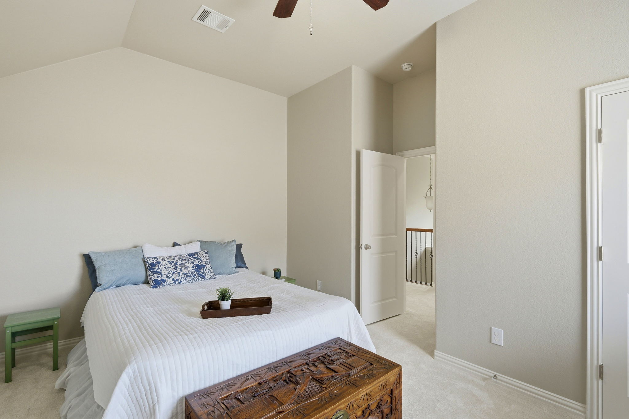 110 Dasher Drive Cedar Park, TX 78613 - Photo 27 of 39 Comfortable bedroom with soft carpeting and high vaulted ceilings creating an airy retreat.