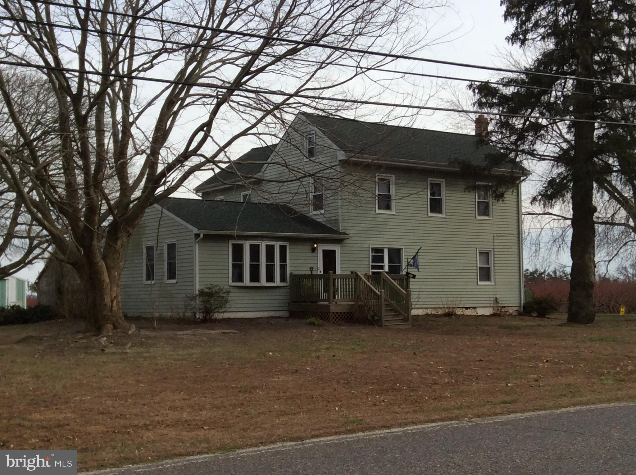 77 Barretts Run Road Bridgeton, NJ 08302 - Photo 14 of 17 a house that has a tree in front of it