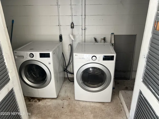 a utility room with dryer and washer