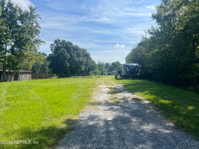 a view of a swimming pool with a yard