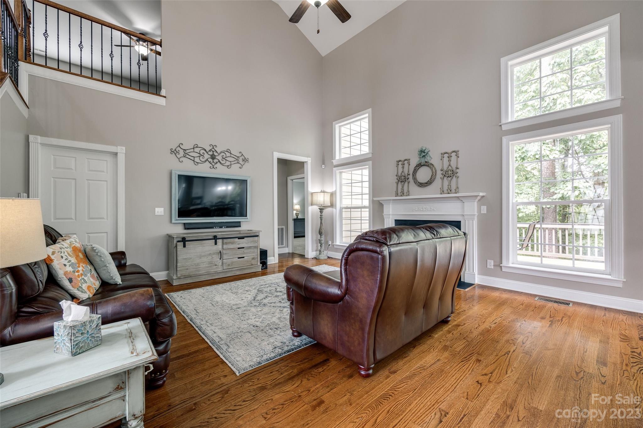 786 Fairway Point Drive Tega Cay, SC 29708 - Photo 13 of 39 a living room with furniture and a flat screen tv