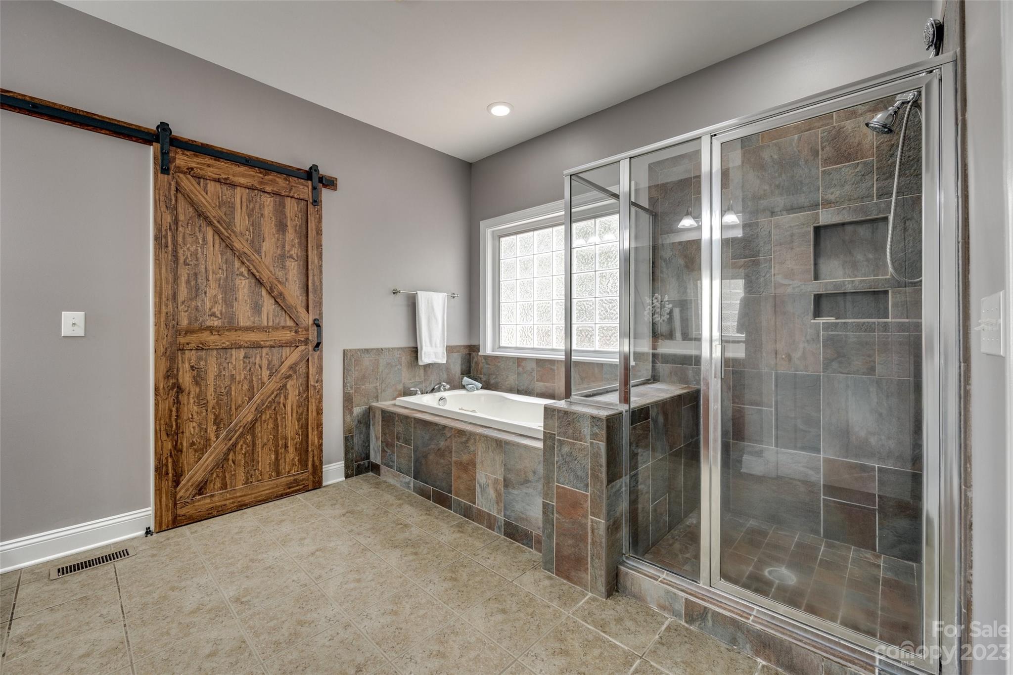 786 Fairway Point Drive Tega Cay, SC 29708 - Photo 17 of 39 a bathroom with a shower and a sink