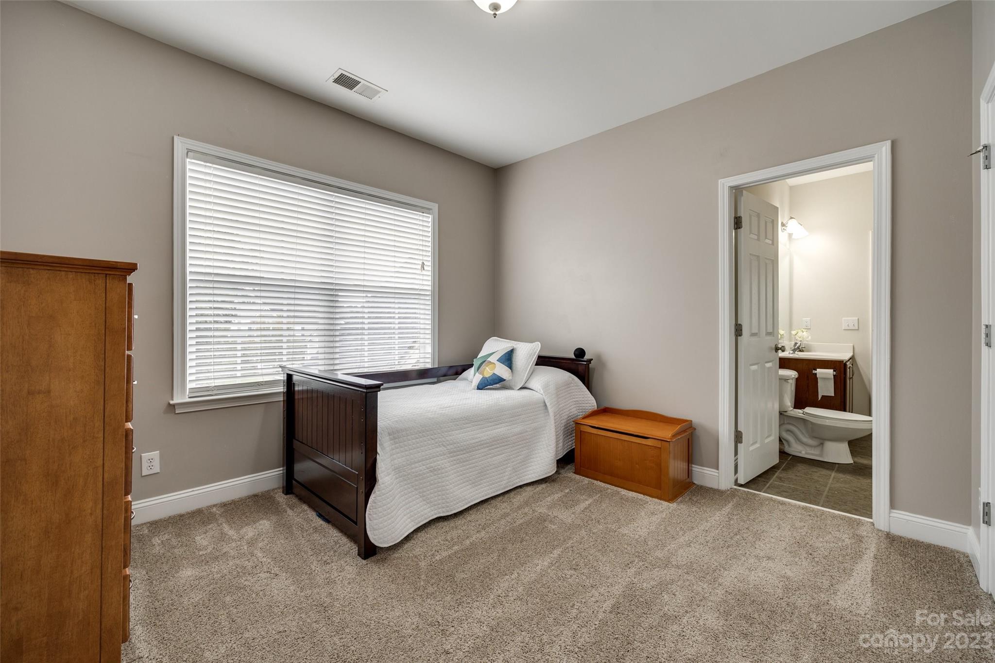 786 Fairway Point Drive Tega Cay, SC 29708 - Photo 21 of 39 a bedroom with furniture and a large window