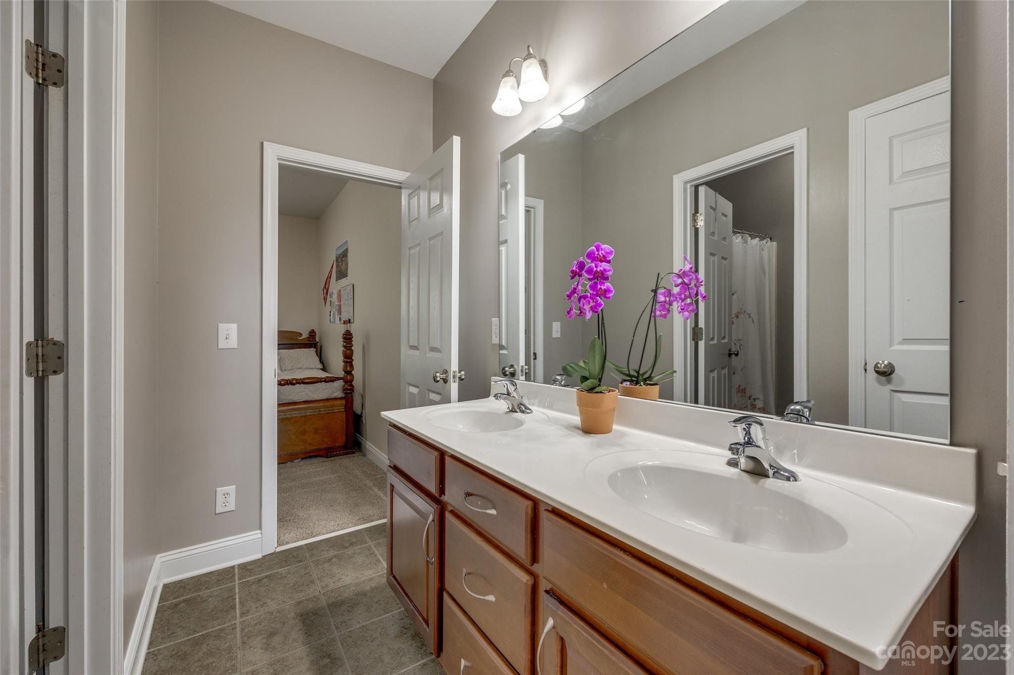 786 Fairway Point Drive Tega Cay, SC 29708 - Photo 25 of 39 a bathroom with a sink vanity and a mirror