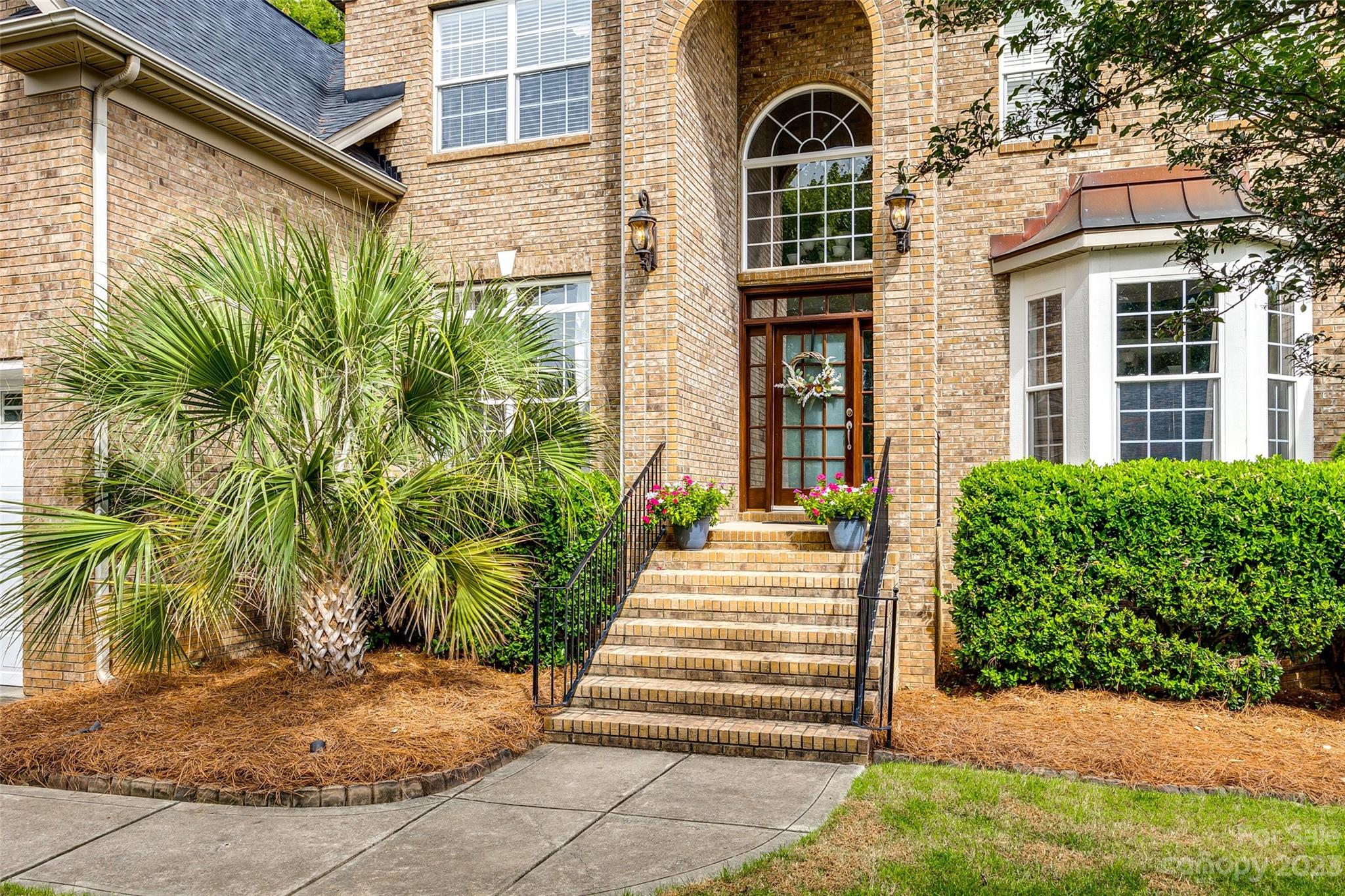 786 Fairway Point Drive Tega Cay, SC 29708 - Photo 3 of 39 a front view of a house with a yard