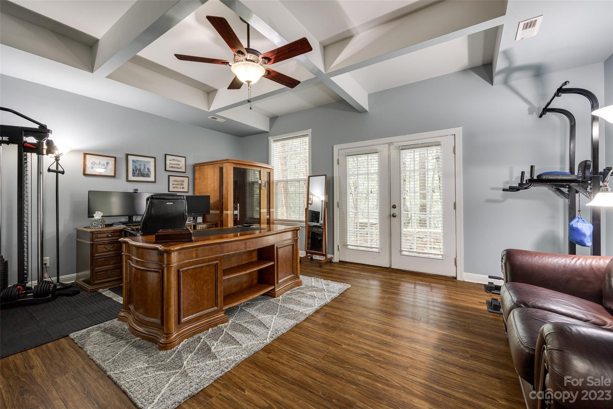 786 Fairway Point Drive Tega Cay, SC 29708 - Photo 31 of 39 a kitchen with stainless steel appliances kitchen island granite countertop a refrigerator a stove a sink and a dining table with wooden floor