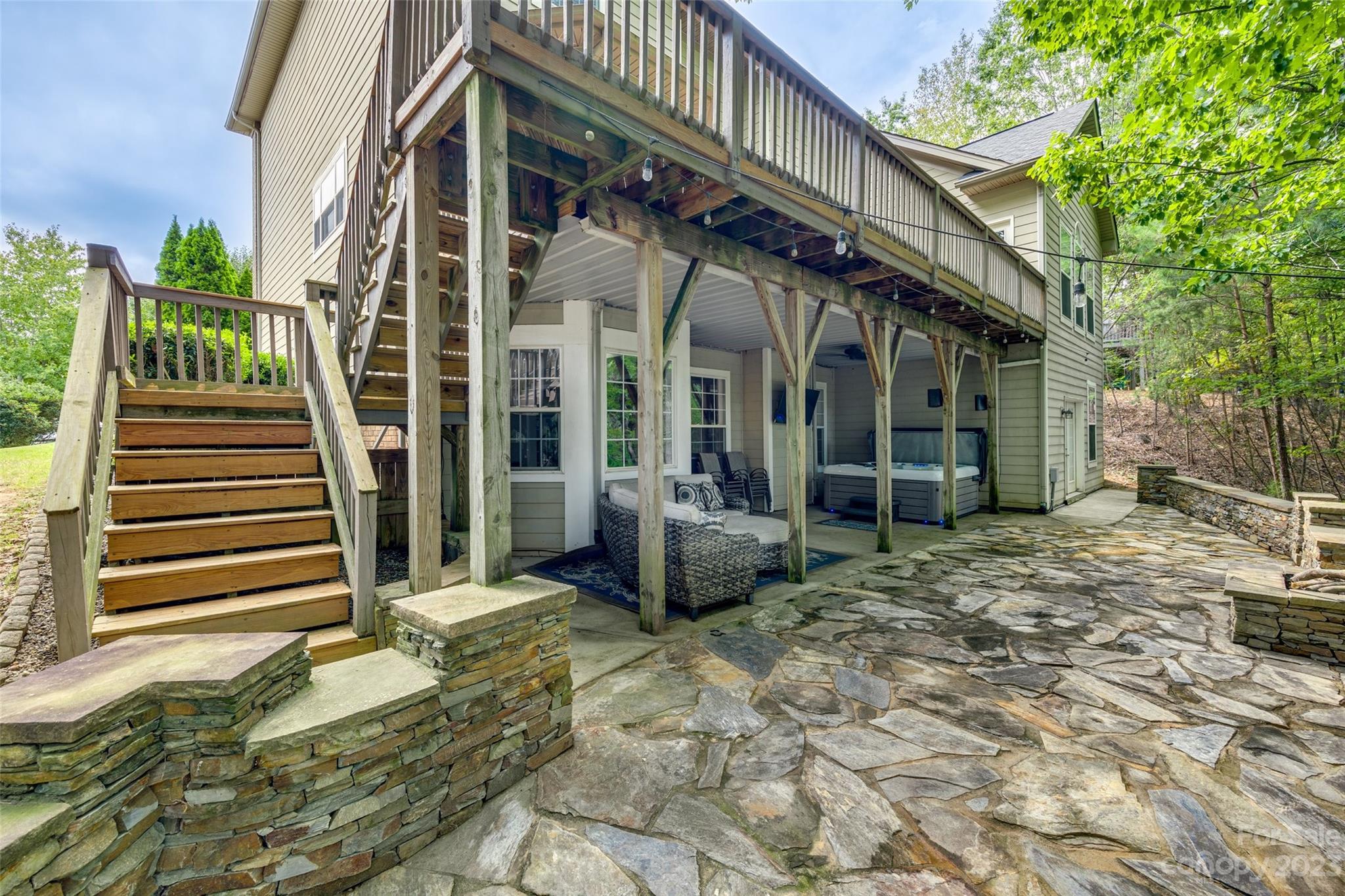 786 Fairway Point Drive Tega Cay, SC 29708 - Photo 33 of 39 a view of a house with entrance stairs and garden