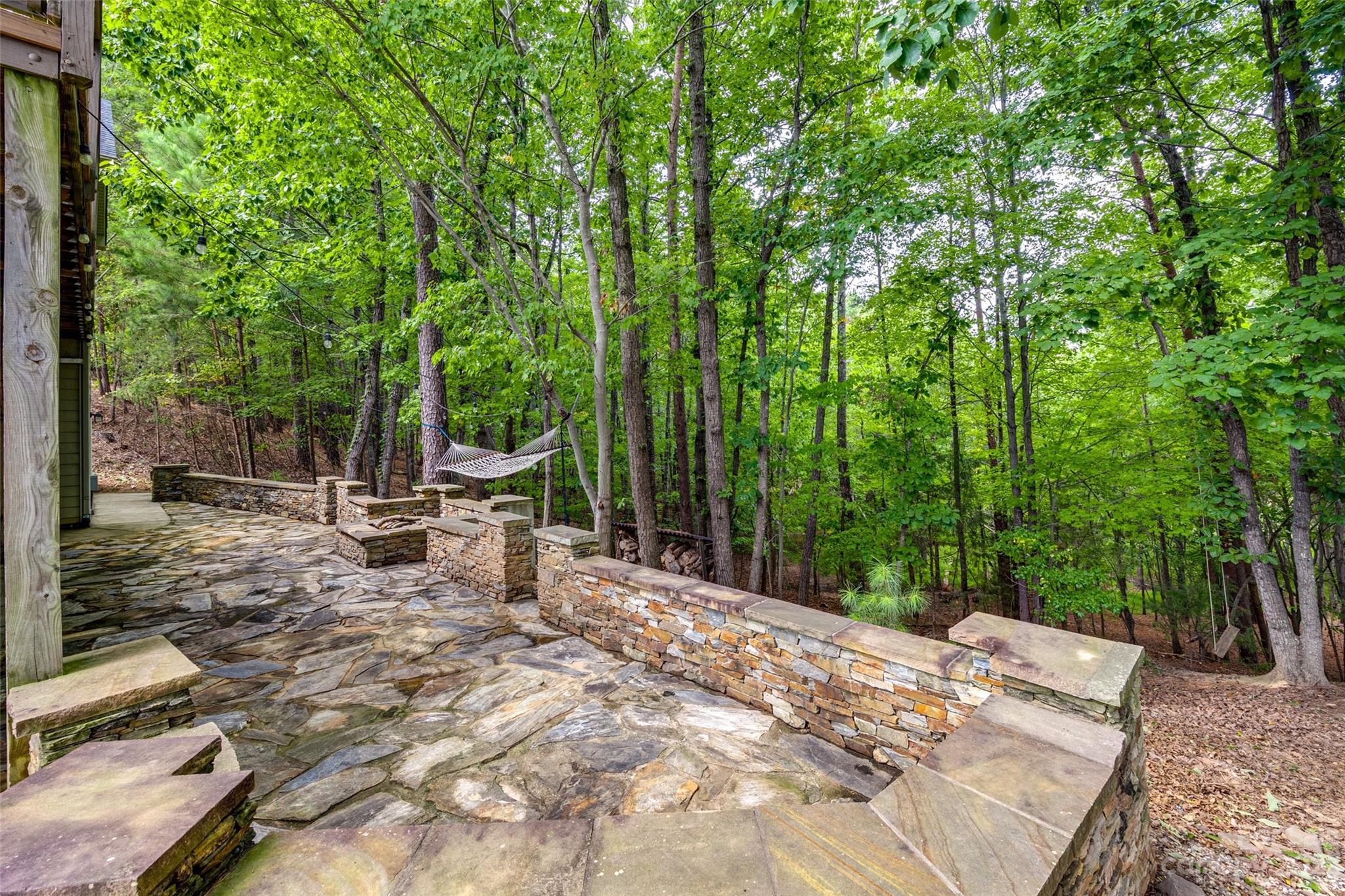 786 Fairway Point Drive Tega Cay, SC 29708 - Photo 35 of 39 a view of a bench in a backyard