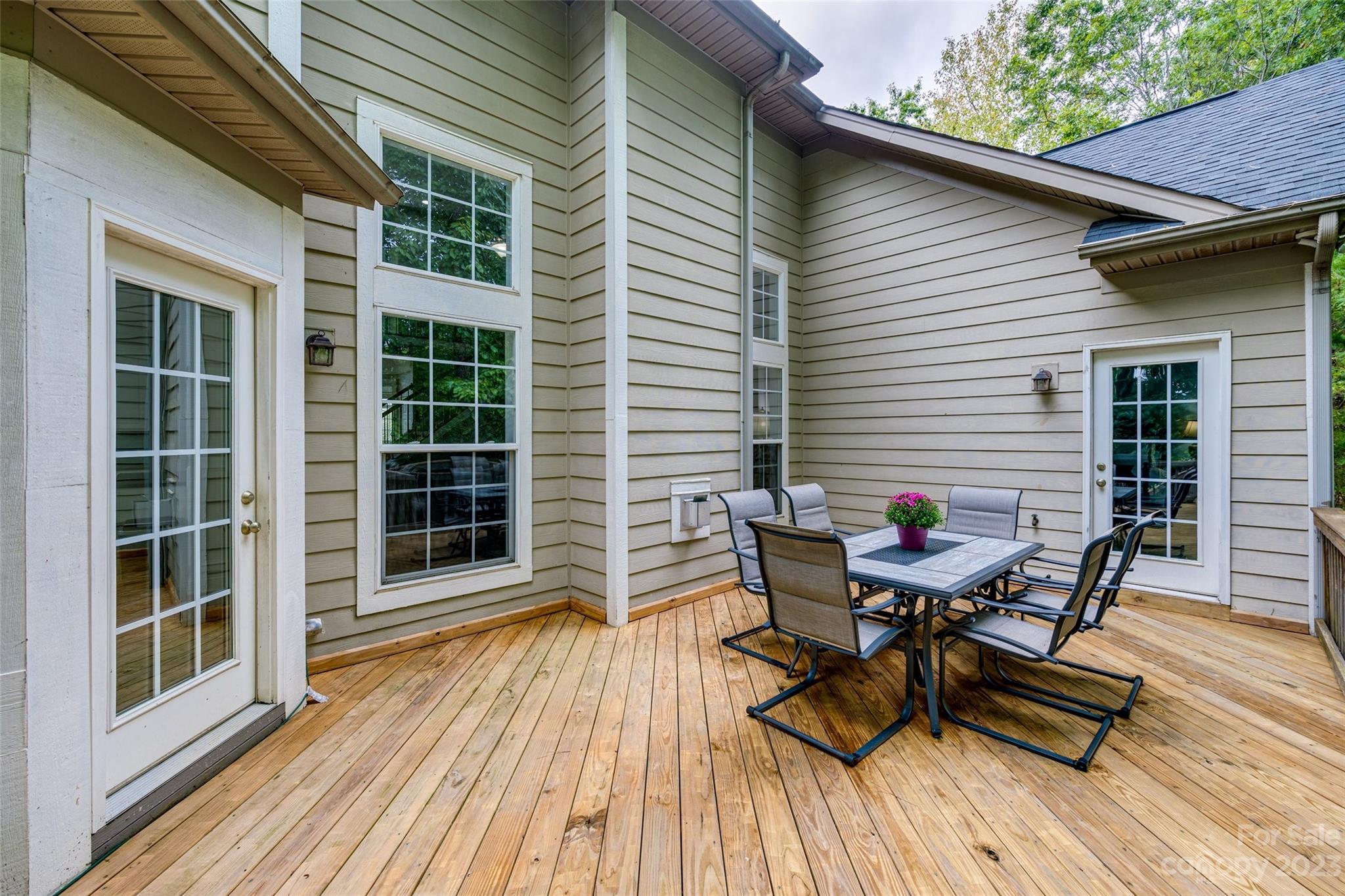 786 Fairway Point Drive Tega Cay, SC 29708 - Photo 36 of 39 a view of a deck with table and chairs and wooden floor