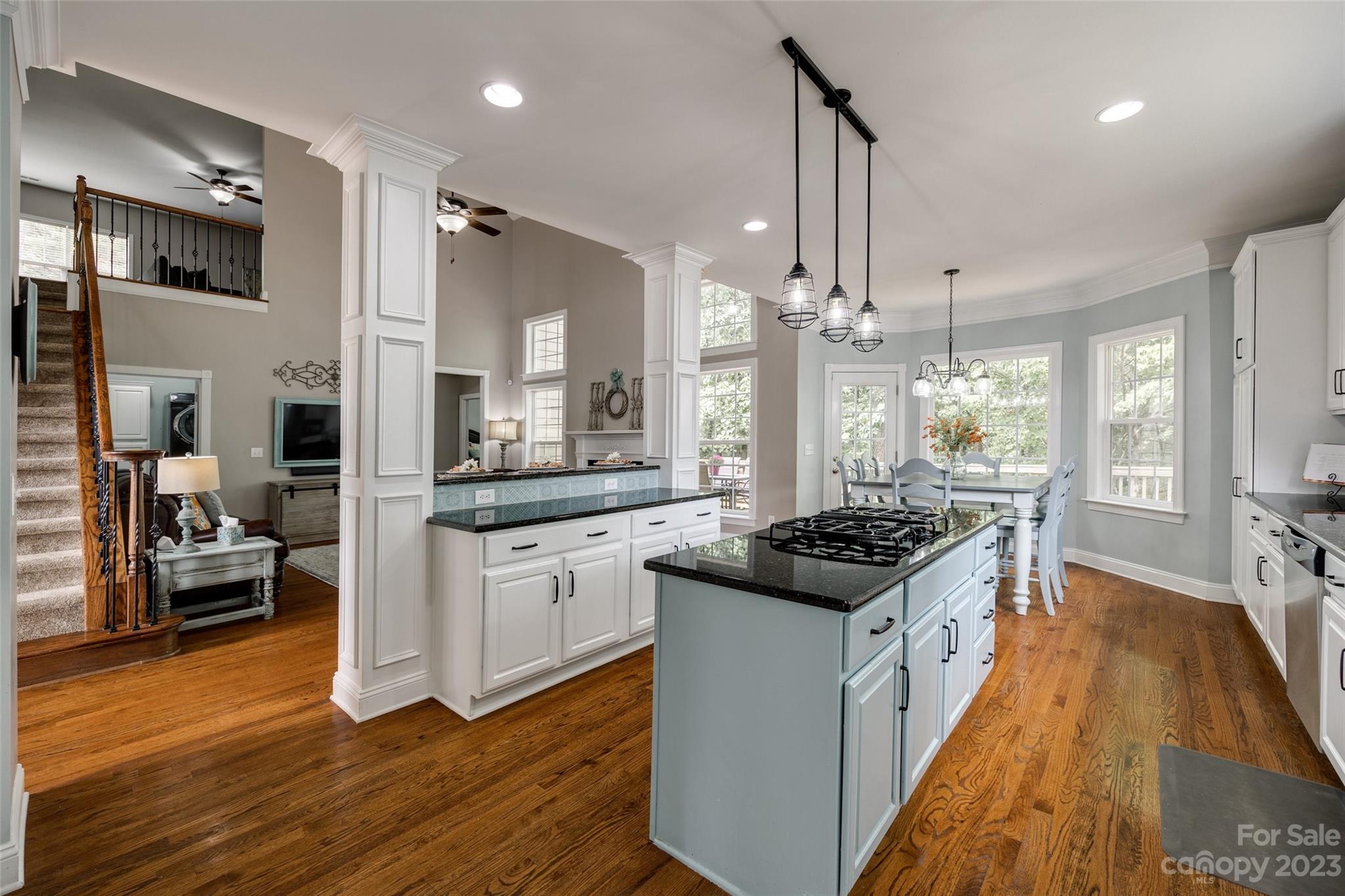 786 Fairway Point Drive Tega Cay, SC 29708 - Photo 8 of 39 a kitchen with granite countertop a stove and cabinets