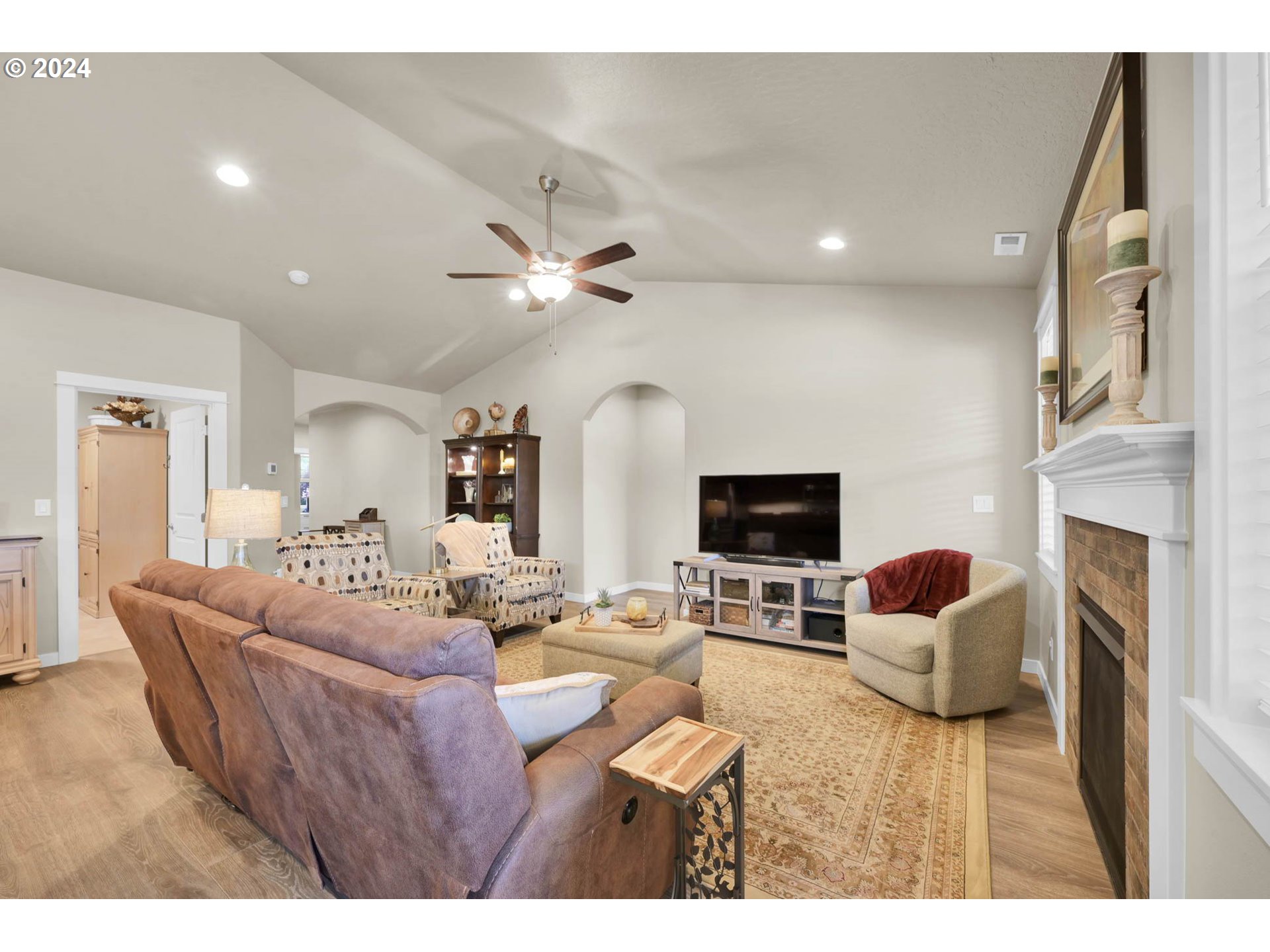 3312 Korbel Street Eugene, OR 97404 - Photo 15 of 48 a living room with fireplace furniture and a flat screen tv