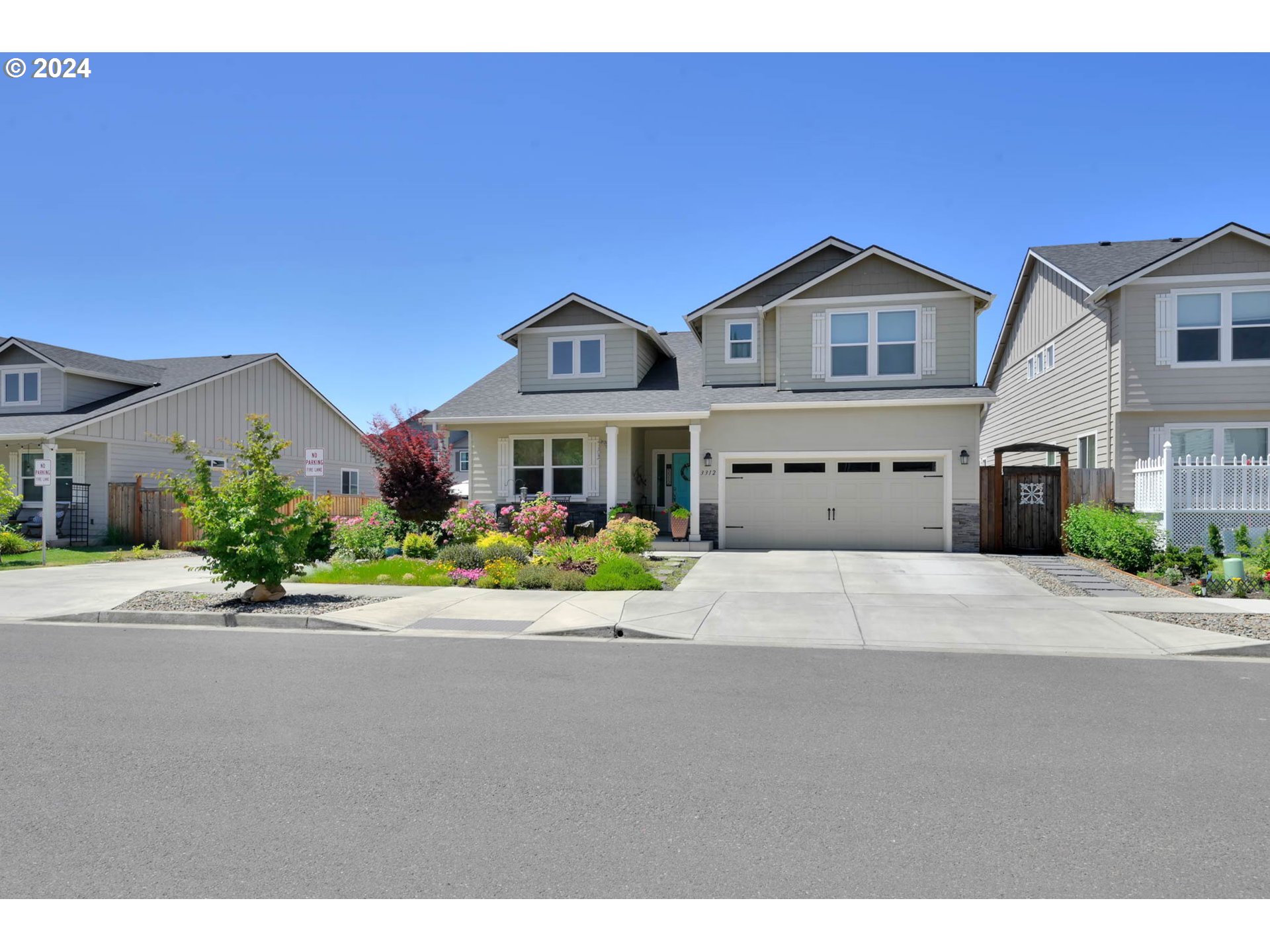 3312 Korbel Street Eugene, OR 97404 - Photo 2 of 48 a front view of a house with a yard and garage