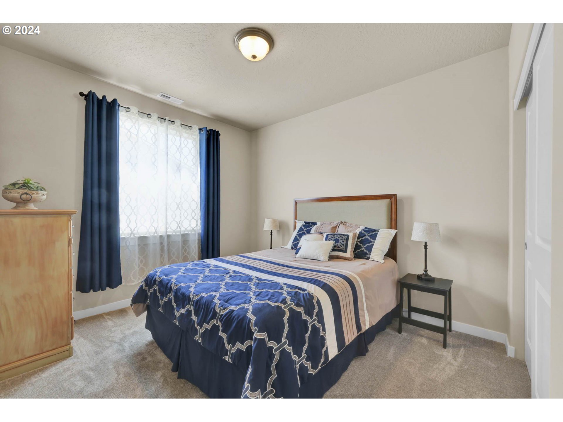 3312 Korbel Street Eugene, OR 97404 - Photo 28 of 48 a bedroom with a bed with wooden floor