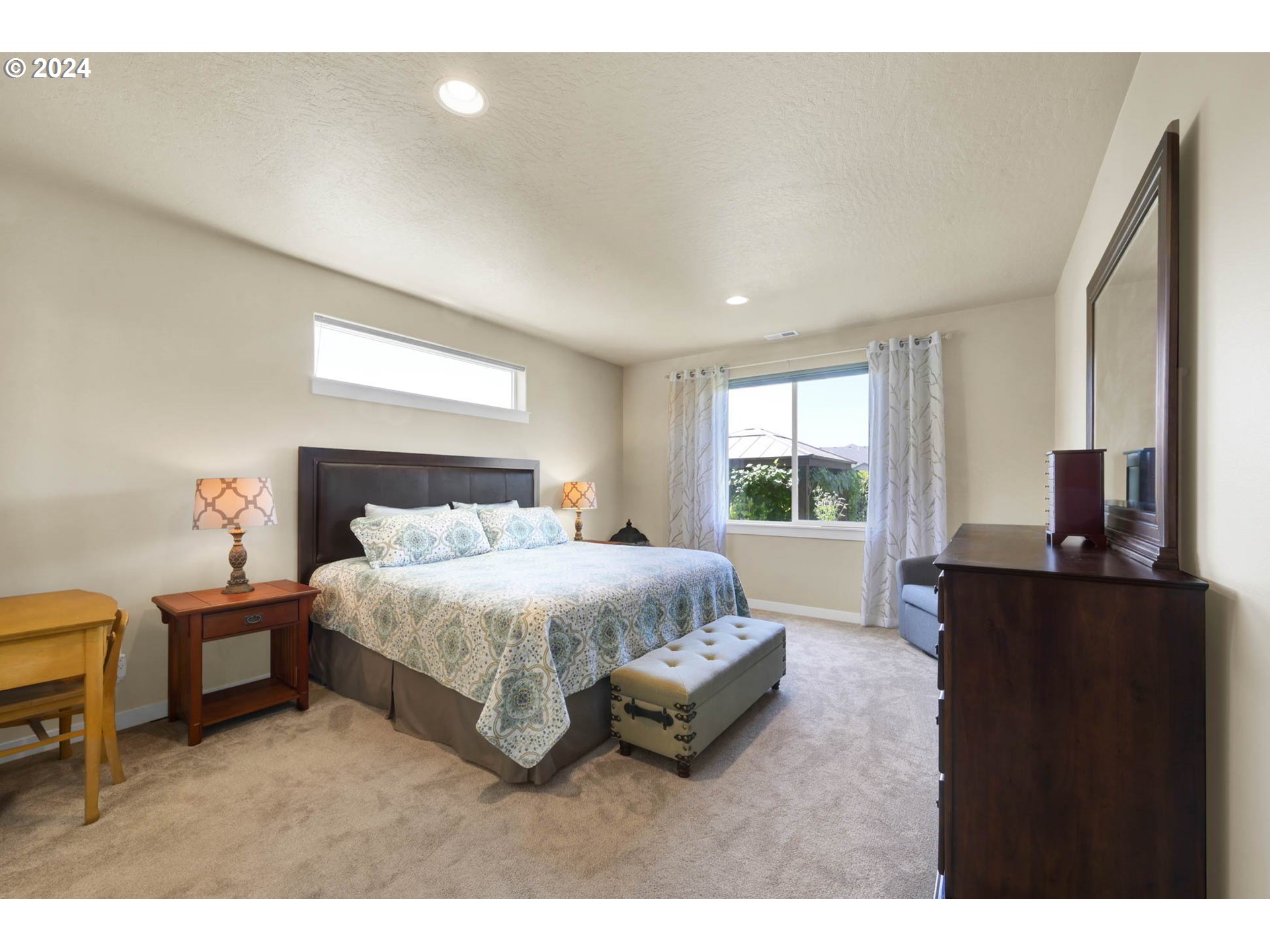 3312 Korbel Street Eugene, OR 97404 - Photo 29 of 48 a spacious bedroom with a bed and a window