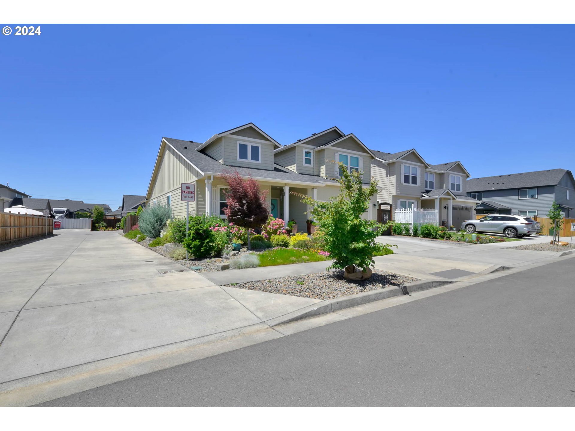 3312 Korbel Street Eugene, OR 97404 - Photo 3 of 48 a front view of a house with a garden and parking
