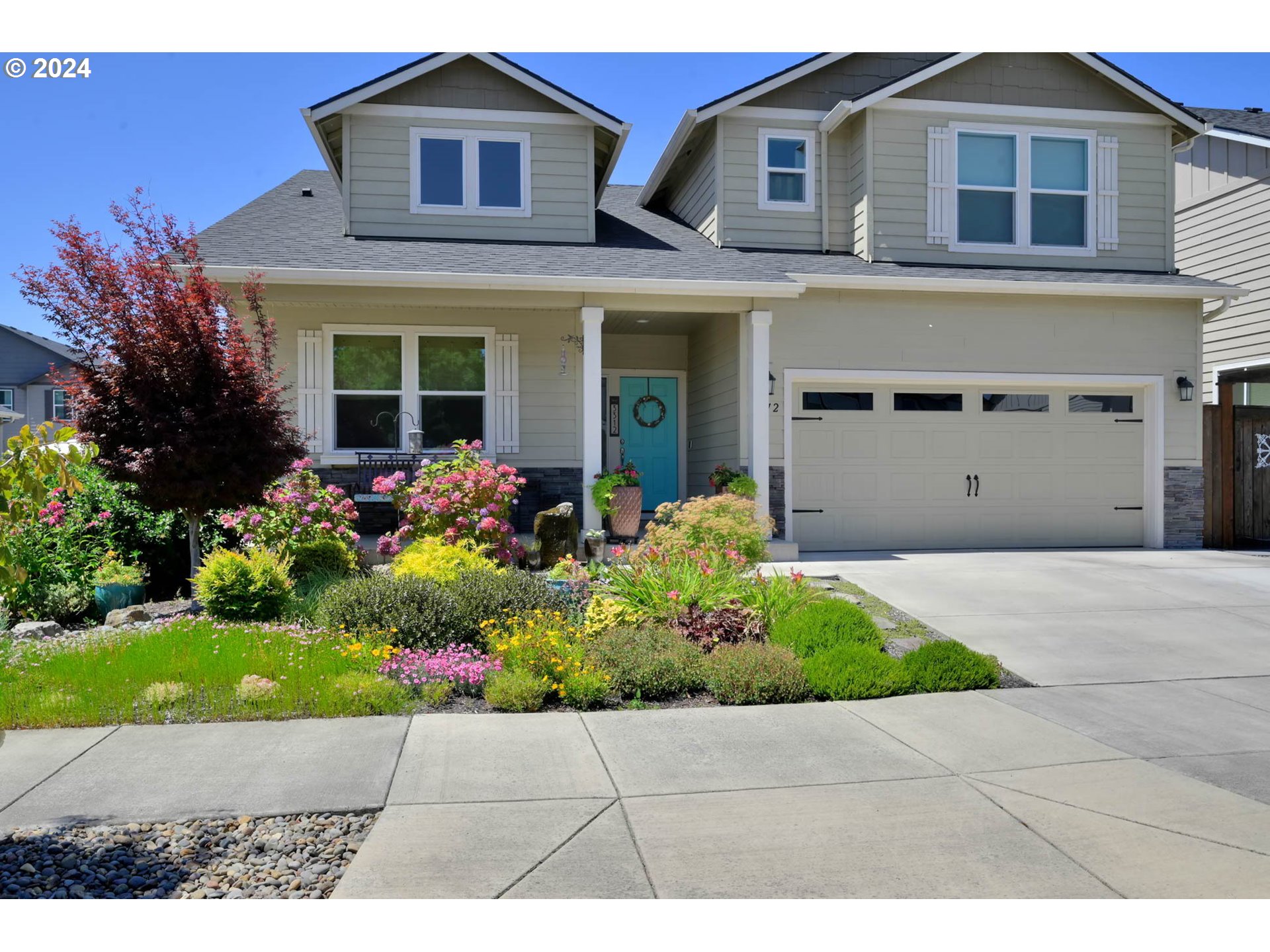 3312 Korbel Street Eugene, OR 97404 - Photo 4 of 48 a front view of a house with a garden