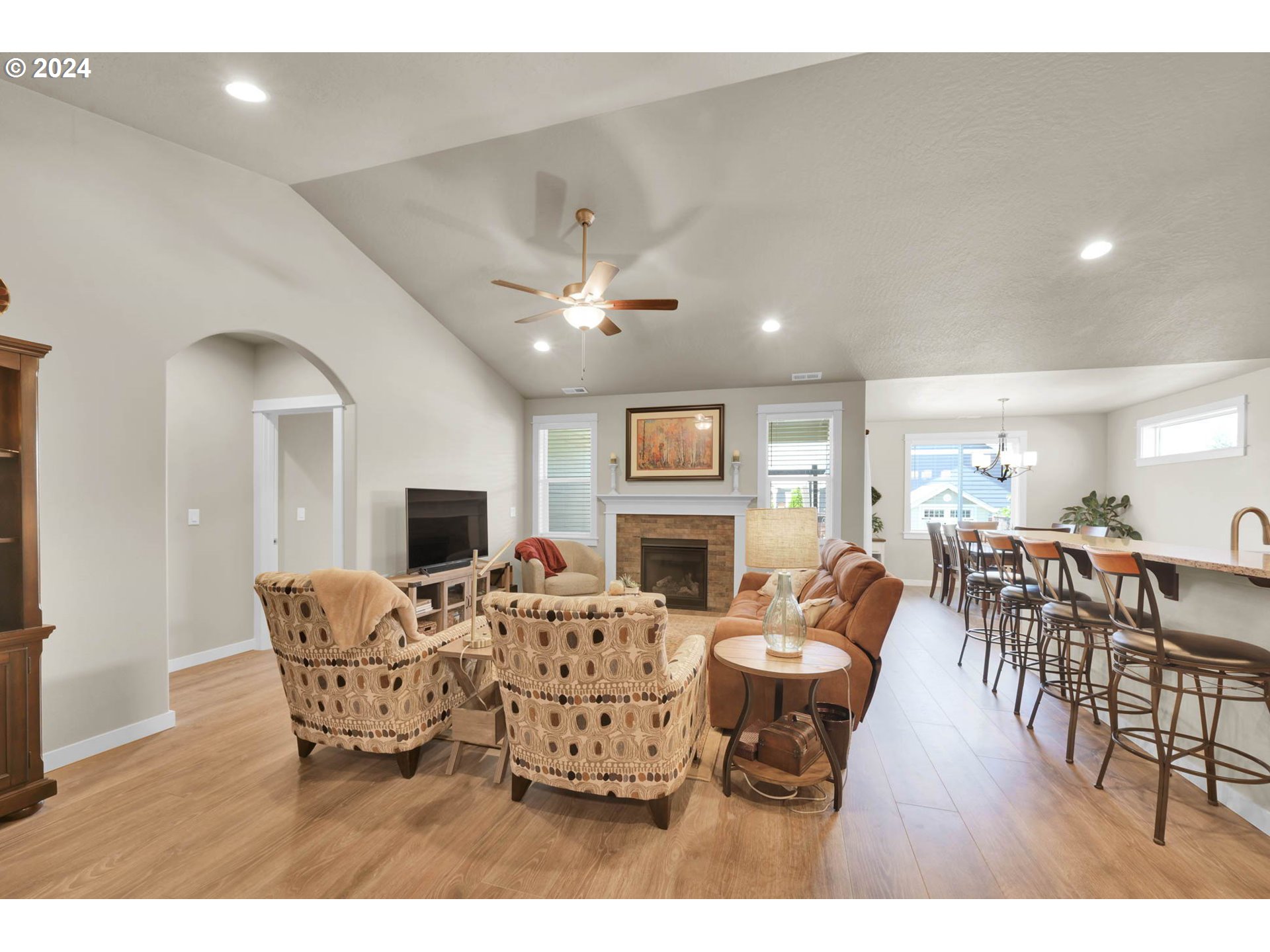 3312 Korbel Street Eugene, OR 97404 - Photo 10 of 48 a living room with fireplace furniture and a wooden floor