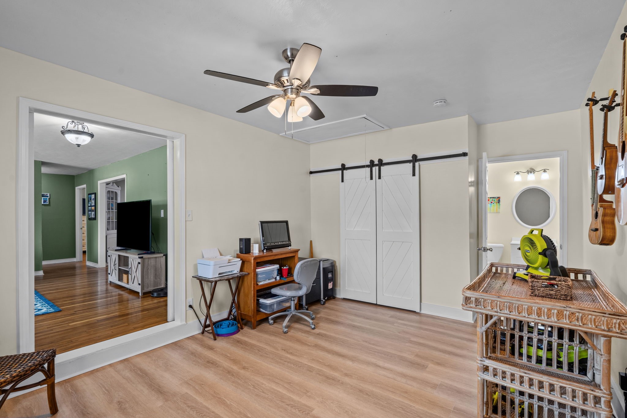 4630 Hudson Road Santa Fe, TX 77517 - Photo 12 of 44 a view of a workspace with furniture and wooden floor