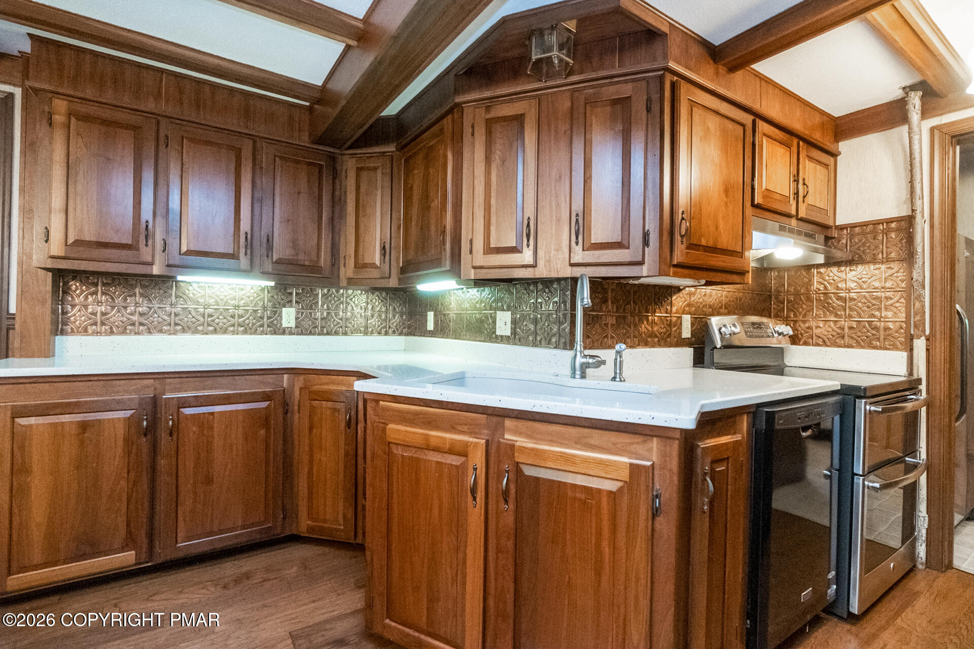 11 East Front Street Jim Thorpe, PA 18229 - Photo 24 of 63 a kitchen with stainless steel appliances granite countertop wooden cabinets a sink and dishwasher