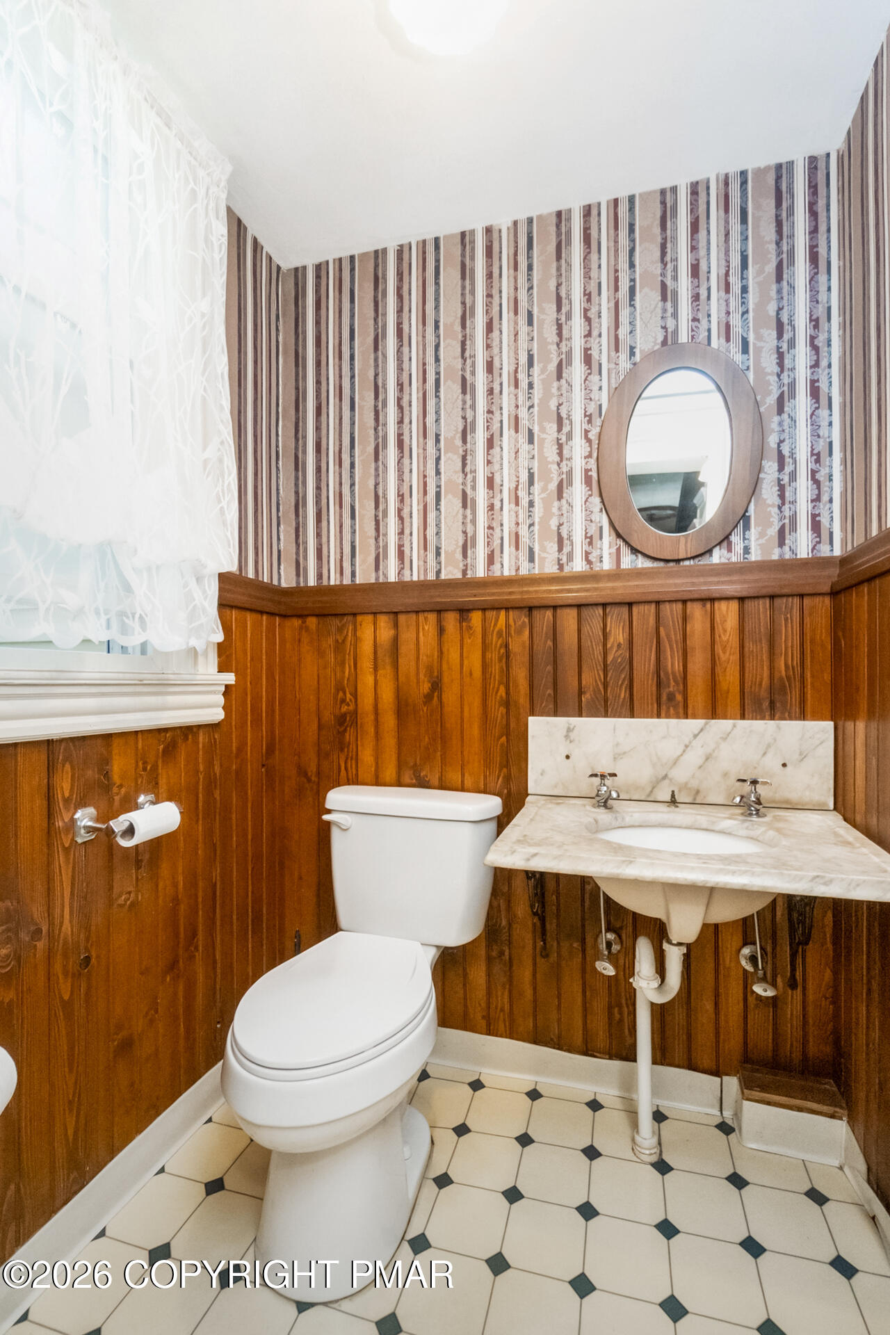 11 East Front Street Jim Thorpe, PA 18229 - Photo 35 of 63 a bathroom with a toilet a sink and a shower curtain