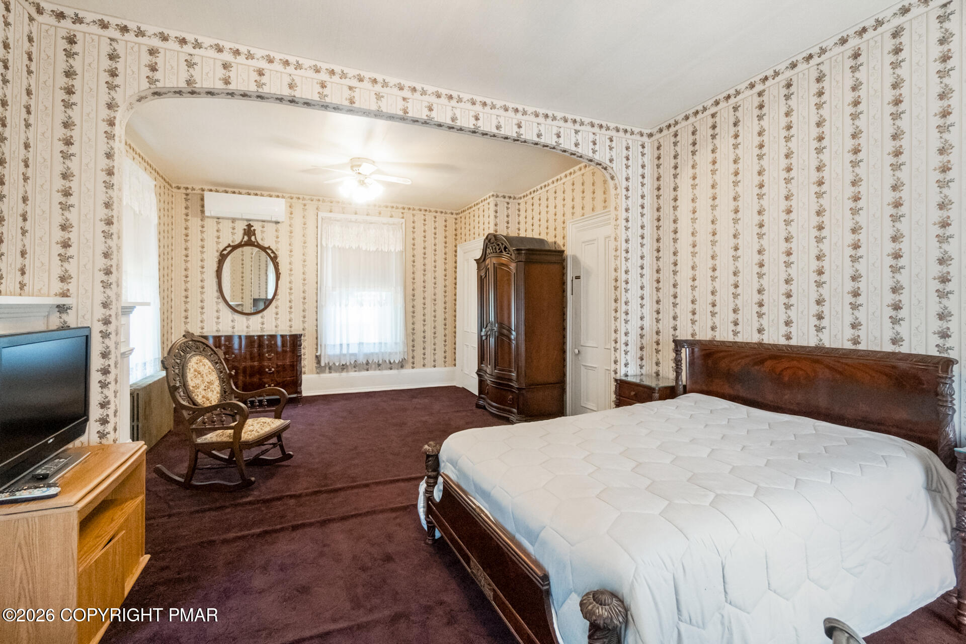 11 East Front Street Jim Thorpe, PA 18229 - Photo 51 of 63 a bedroom with a bed mirror and a large window