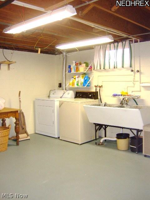13634 Carpenter Road Garfield Heights, OH 44125 - Photo 23 of 24 The utility room is super clean and organized. The washer and dryer will stay!