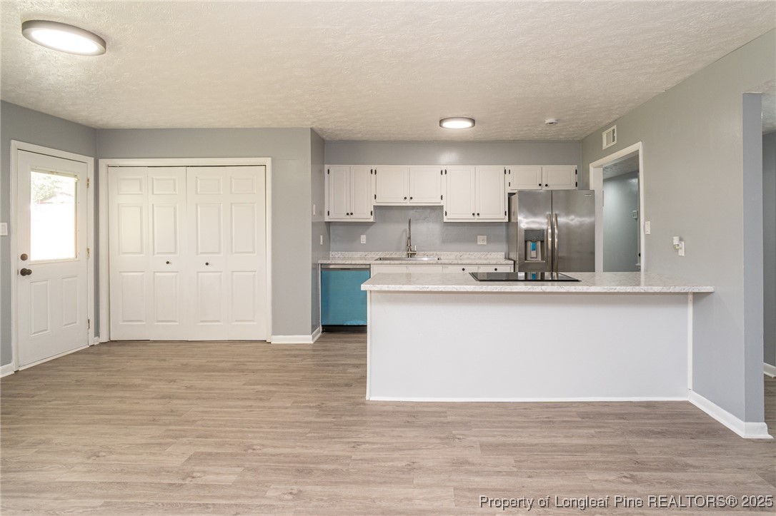 4748 Old Spears Road Fayetteville, NC 28304 - Photo 12 of 37 a view of kitchen with wooden floor