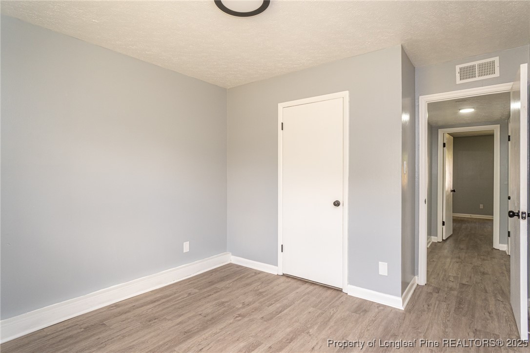 4748 Old Spears Road Fayetteville, NC 28304 - Photo 19 of 37 a view of a room with wooden floor