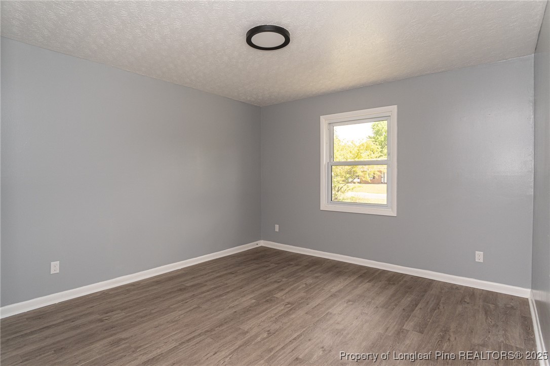 4748 Old Spears Road Fayetteville, NC 28304 - Photo 20 of 37 a view of a room with wooden floor and windows