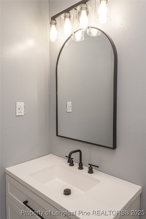 4748 Old Spears Road Fayetteville, NC 28304 - Photo 24 of 37 a bathroom with a sink and a mirror
