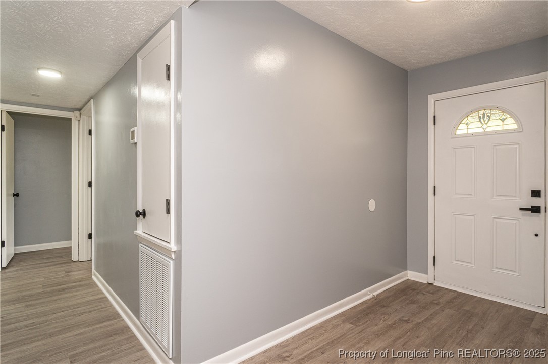 4748 Old Spears Road Fayetteville, NC 28304 - Photo 6 of 37 a view of empty room with wooden floor