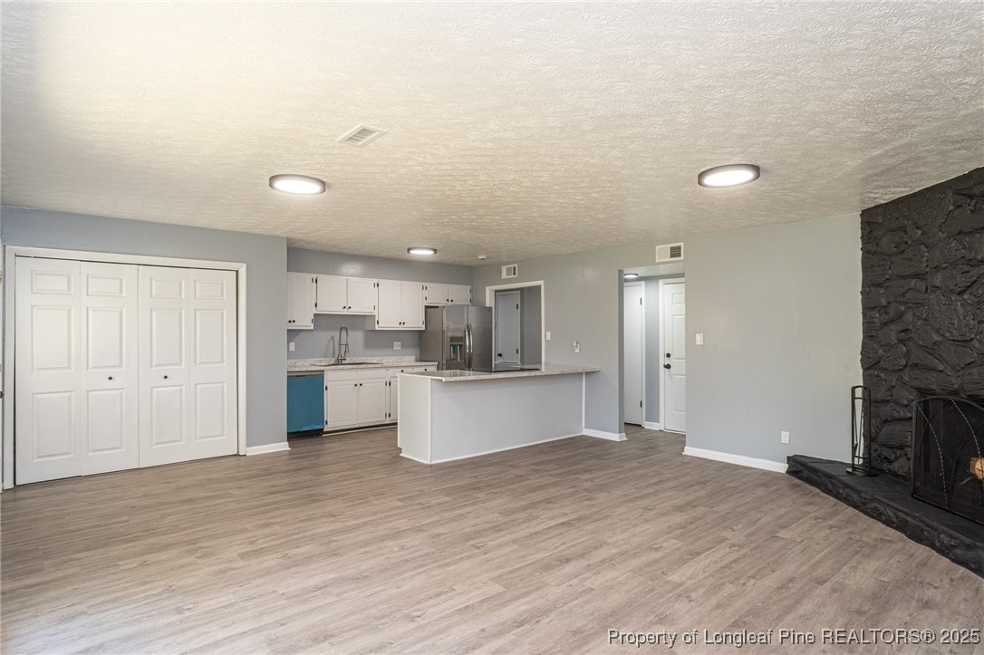 4748 Old Spears Road Fayetteville, NC 28304 - Photo 10 of 37 a view of kitchen with wooden floor and electronic appliances