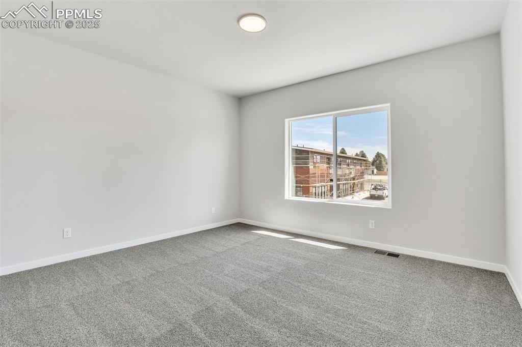 241 Front Street, Unit 101 Monument, CO 80132 - Photo 17 of 29 an empty room with a window