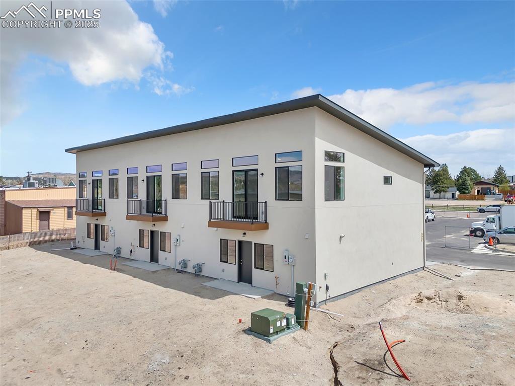 241 Front Street, Unit 101 Monument, CO 80132 - Photo 27 of 29 a view of a house with a snow in the background