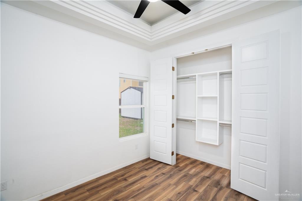 3018 Arrow Lane Weslaco, TX 78596 - Photo 15 of 22 a view of empty room with wooden floor and fan