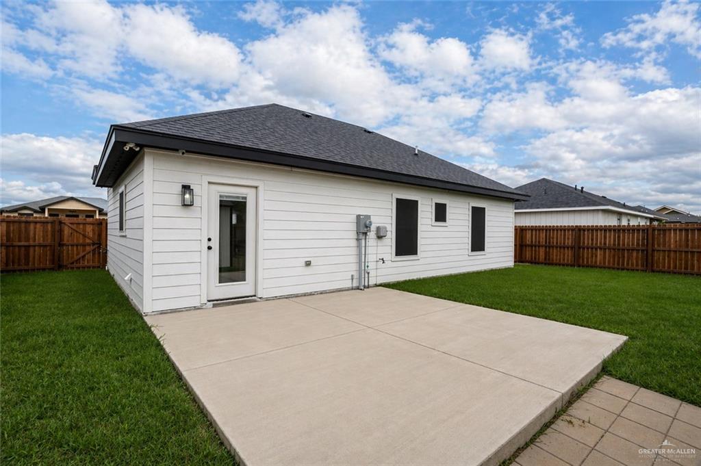 3018 Arrow Lane Weslaco, TX 78596 - Photo 18 of 22 a front view of a house with a yard