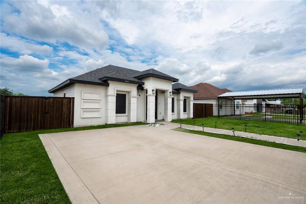 3018 Arrow Lane Weslaco, TX 78596 - Photo 2 of 22 front view of house with a yard