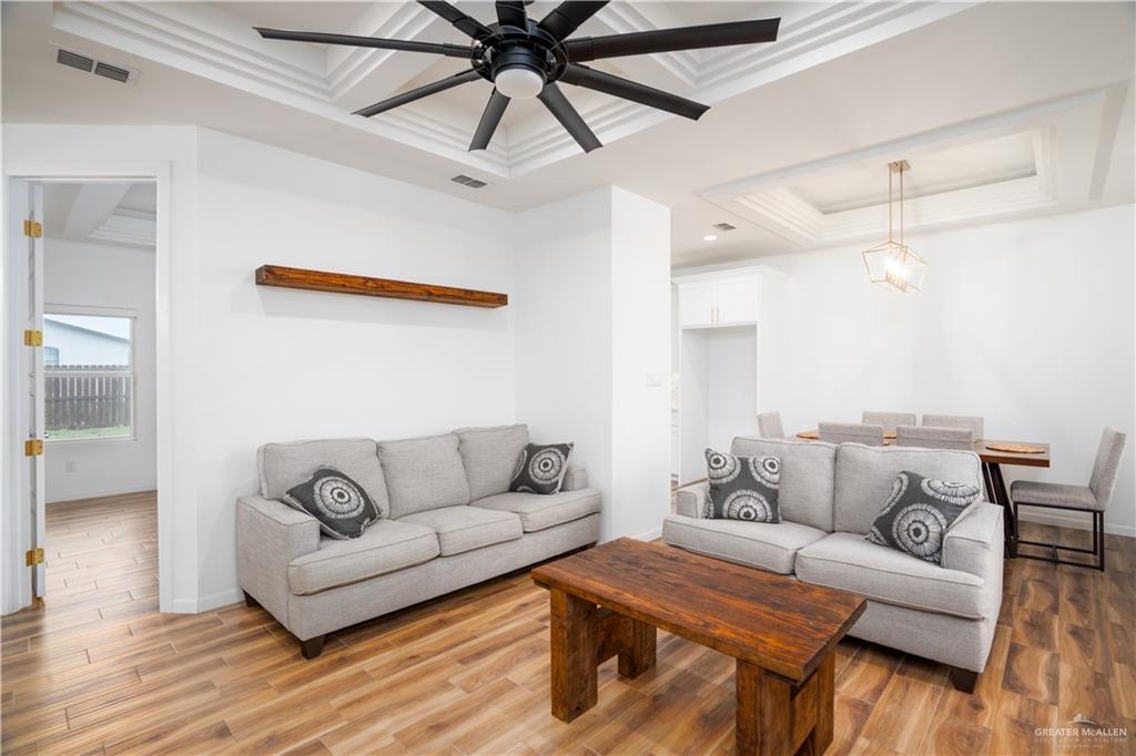 3018 Arrow Lane Weslaco, TX 78596 - Photo 3 of 22 a living room with furniture and a wooden floor