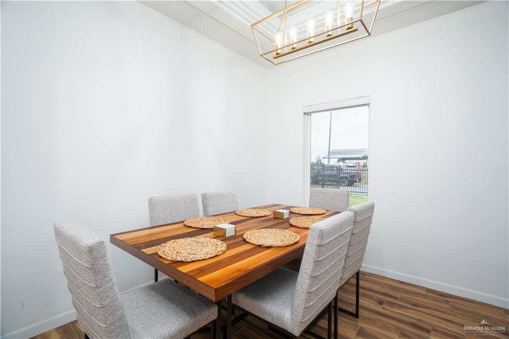 3018 Arrow Lane Weslaco, TX 78596 - Photo 10 of 22 a dining room with furniture and wooden floor