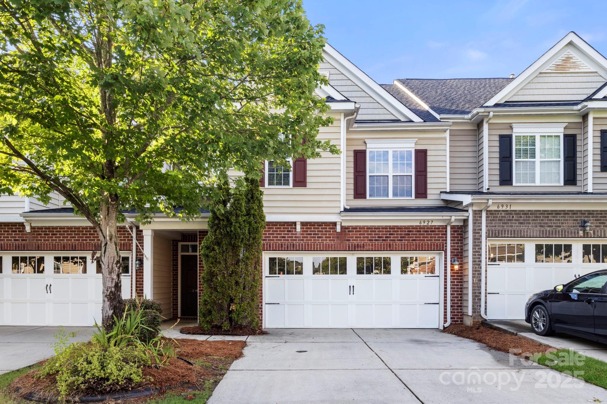 front view of a building with a garden