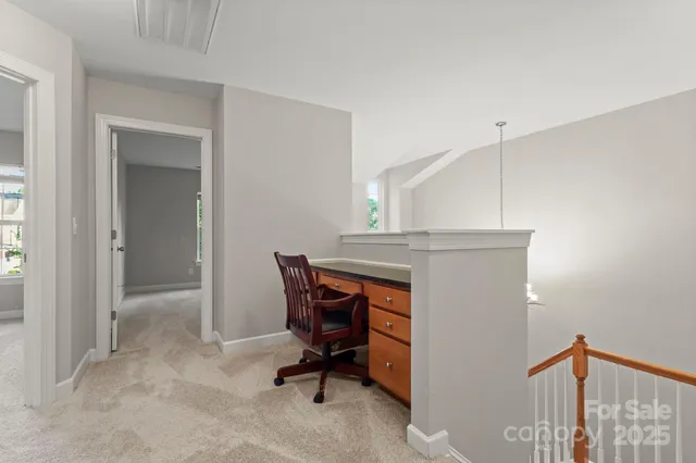 a workspace with furniture and a window