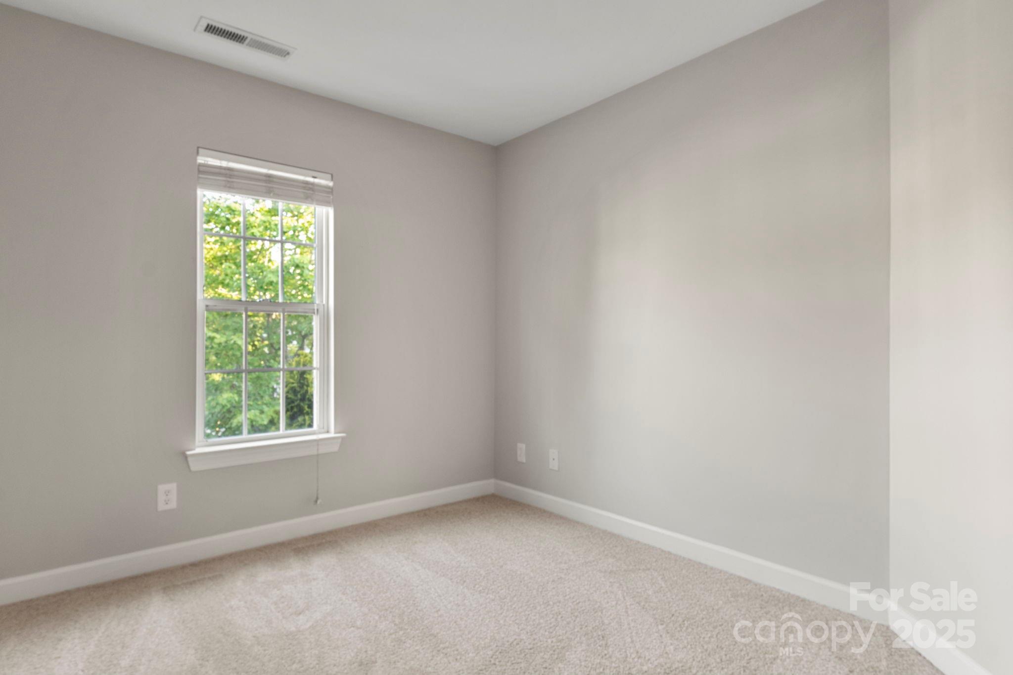 6927 Maricopa Road Charlotte, NC 28277 - Photo 17 of 32 an empty room with a window