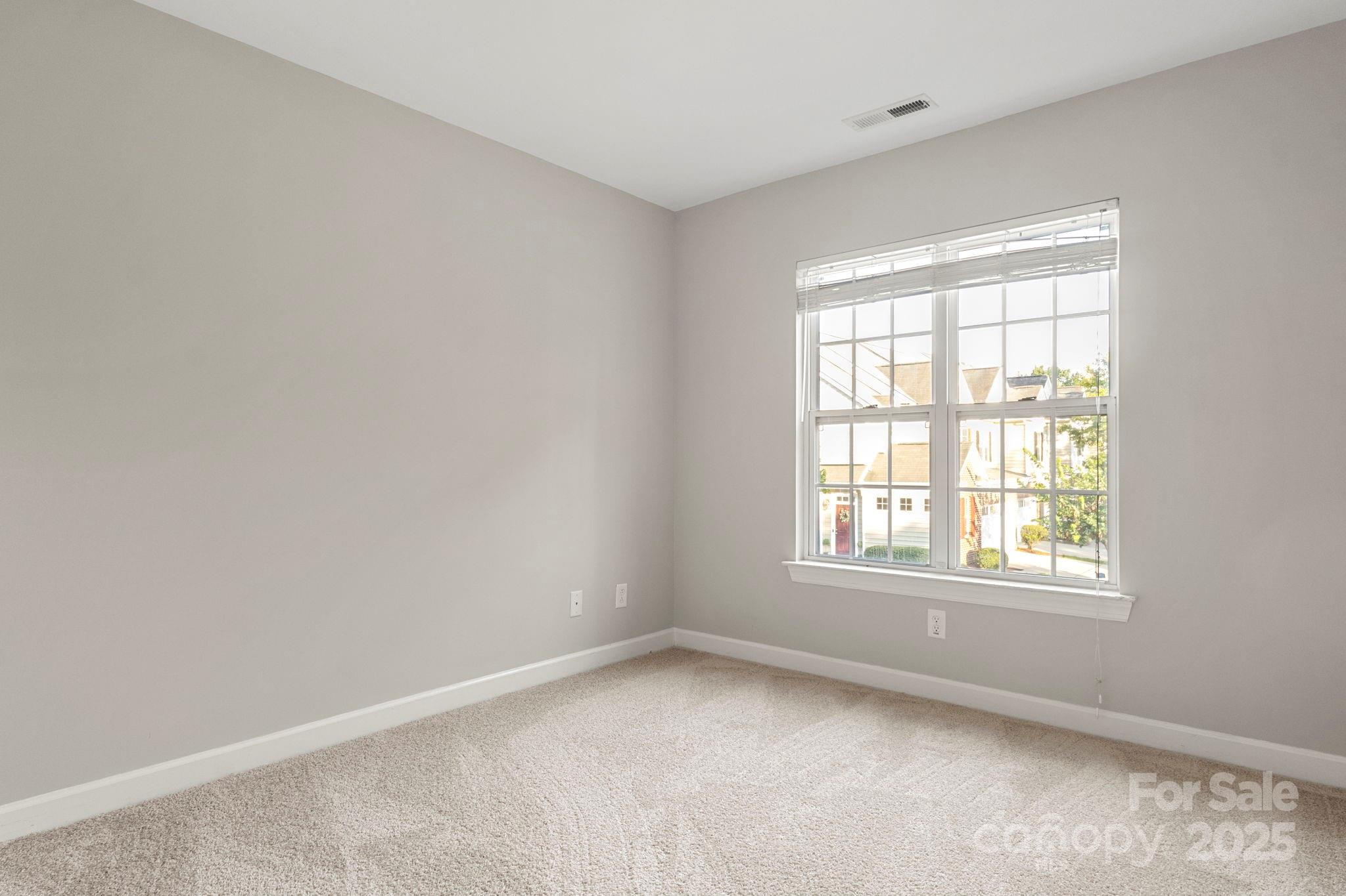 6927 Maricopa Road Charlotte, NC 28277 - Photo 19 of 32 an empty room with a window